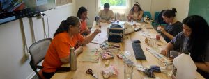 Staff and students at a beading workshop in First Nations House.