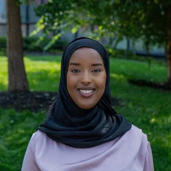 Headshot of Ayan smiling.