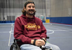 Beau smiling and wearing a University of Toronto sweatshirt.