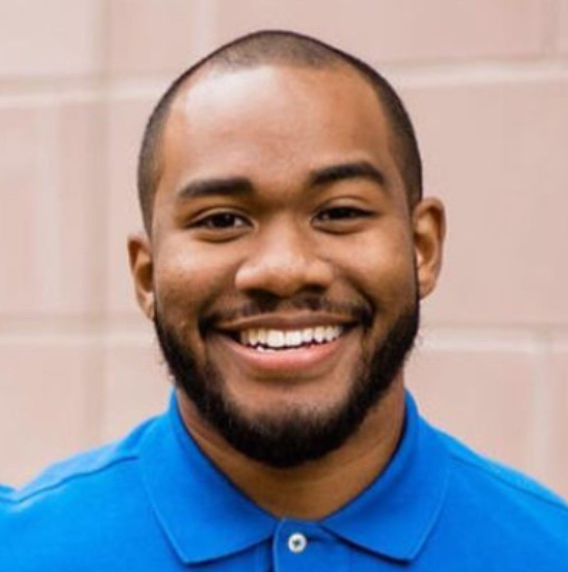 Headshot of Chris smiling.