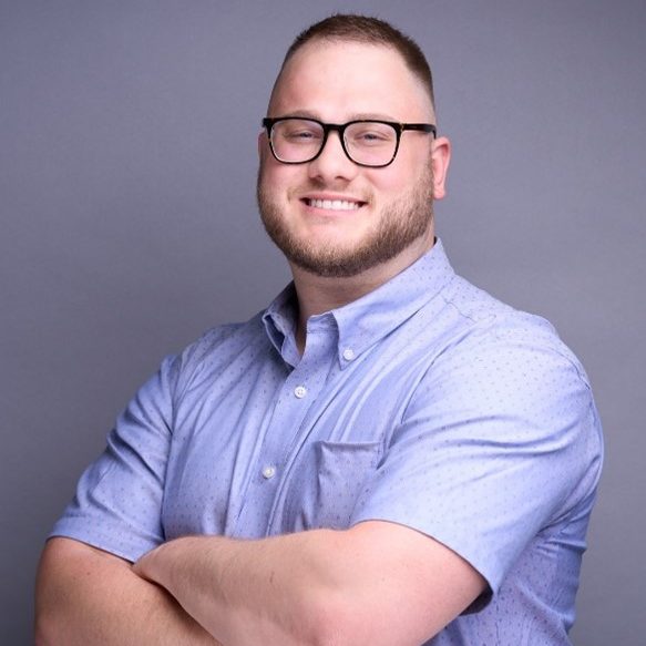 Headshot of Claudio smiling.