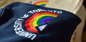 University of Toronto sweater with Pride flag in the shape of a rainbow.