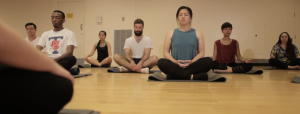 Group of students meditating