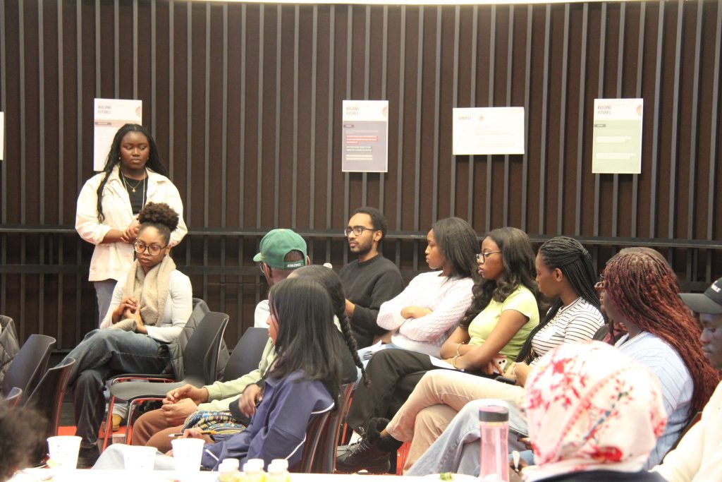 View of crowd listening talk at Building Futures 2025 event.