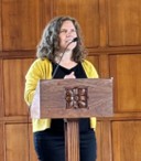 Jeanette speaking at a podium.