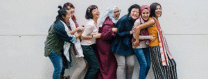 Diverse group of 6 young women laughing