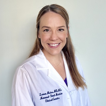 Dr. Meiss smiling and wearing a doctor's coat embroidered saying, "Lauren Meiss, MD, MSc, Maternal-Fetal Medicine Clinical Genetics.
