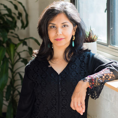 Shehla Khan standing by window