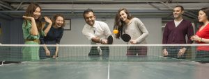 Grad students playing ping pong