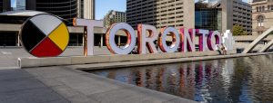 Toronto sign with Medicine Wheel in Nathan Philips Square.