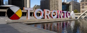 Toronto sign with Medicine Wheel.
