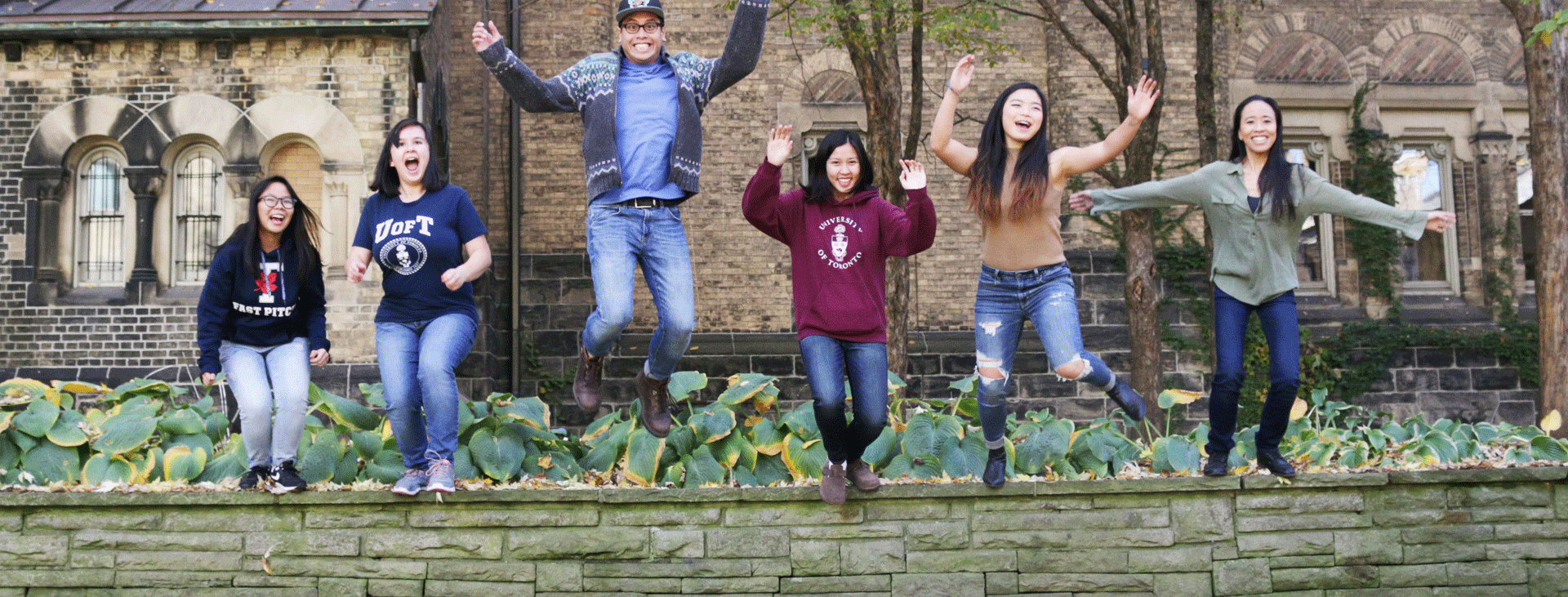 6 students jumping for joy